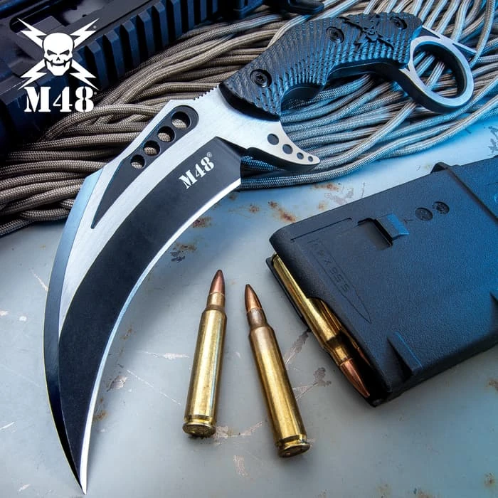 M48 Liberator Falcon Karambit Knife And Sheath - Cast Stainless Steel Blade, Black Oxide Coating, Injection Molded Nylon Handle - Length 10” 1 M48 Liberator Falcon Karambit Knife And Sheath - Cast Stainless Steel Blade, Black Oxide Coating, Injection Molded Nylon Handle - Length 10”